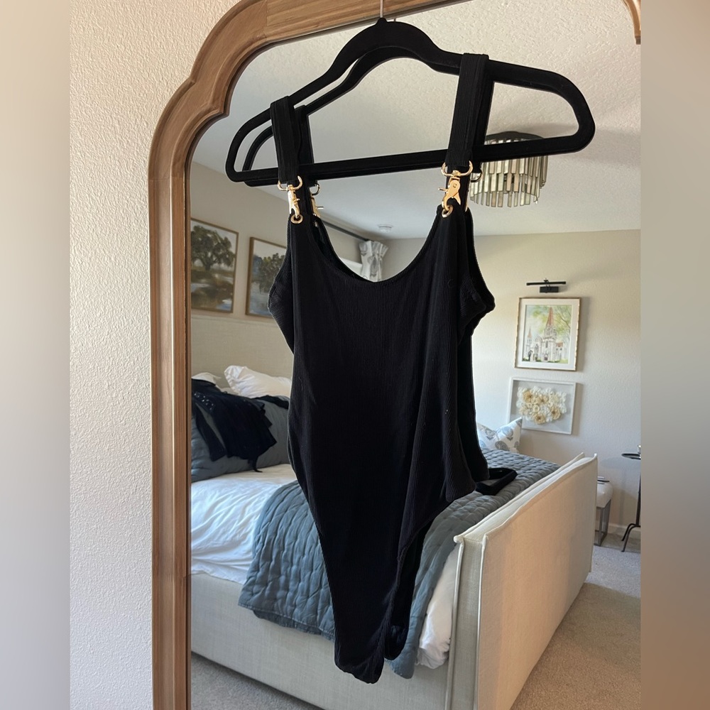 Black body suit with buckles